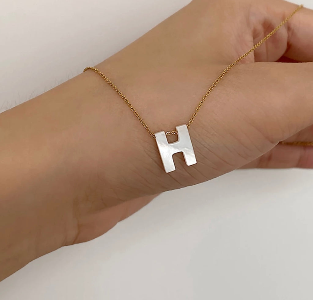 Initials in mother-of-pearl