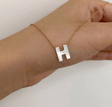 Initials in mother-of-pearl