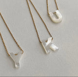 Initials in mother-of-pearl