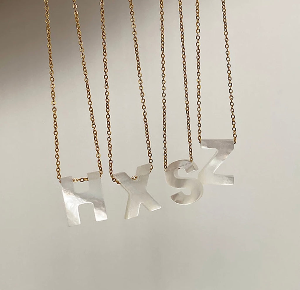 Initials in mother-of-pearl