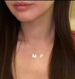 Initials in mother-of-pearl